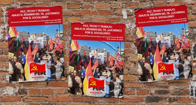 Carteles PCPE sobre muro de ladrillo
