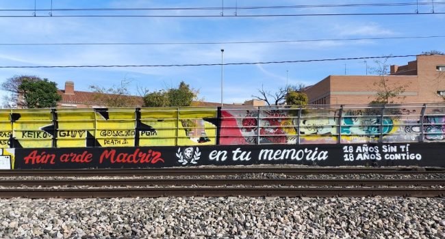Mural-pintada en recuerdo de Carlos Palomino en el 18º aniversario de su asesinato | Asamblea en memoria de Carlos Palomino