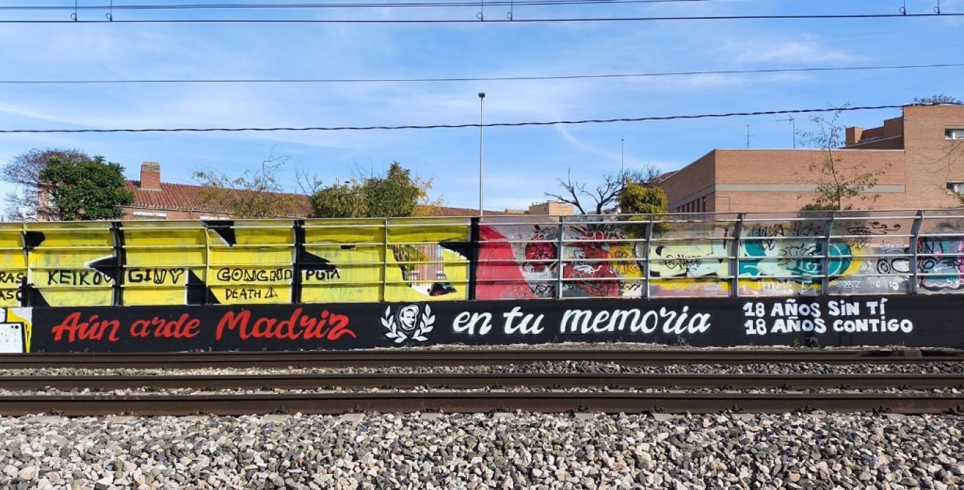 Mural-pintada en recuerdo de Carlos Palomino en el 18º aniversario de su asesinato | Asamblea en memoria de Carlos Palomino