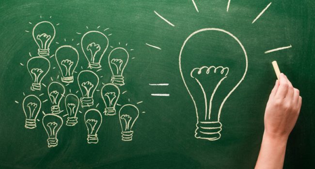 light bulbs sketched on chalkboard Many small ideas make a big one